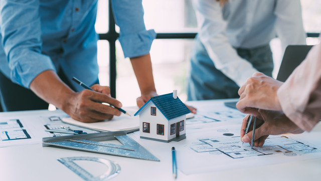 640-a-group-of-architects-are-designing-a-house-model-engineers-and-architects-working-together-to-plan-a-house-building-project-dcfedbf.jpg